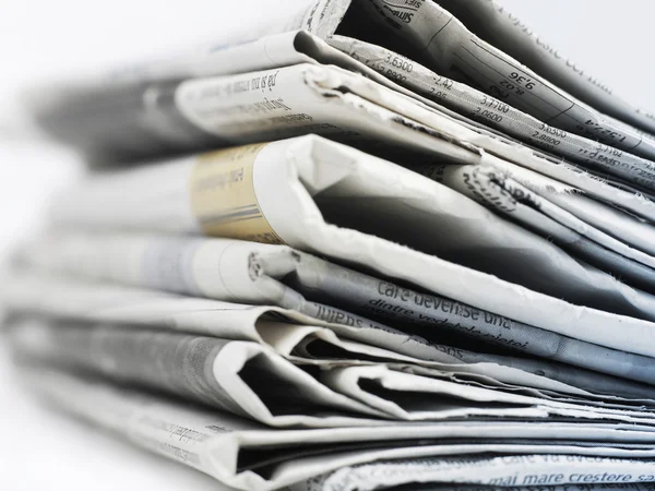 Newspapers close-up on gray — Stock Photo, Image