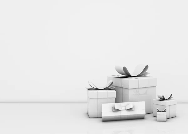 Geschenkboxen und leere Wand — Stockfoto