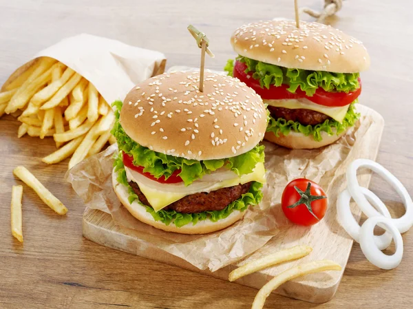 Cheeseburgers with fries — Stock Photo, Image