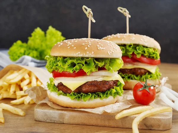 Cheeseburgers with fries — Stock Photo, Image