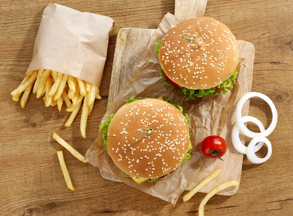 Cheeseburgers with fries — Stock Photo, Image