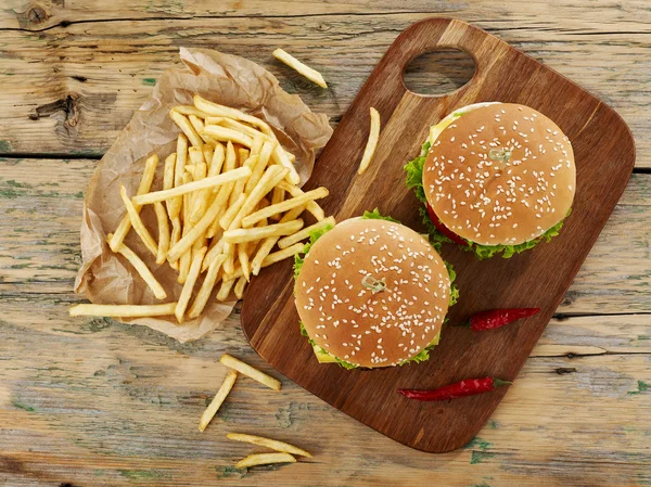 Cheeseburgers with fries — Stock Photo, Image