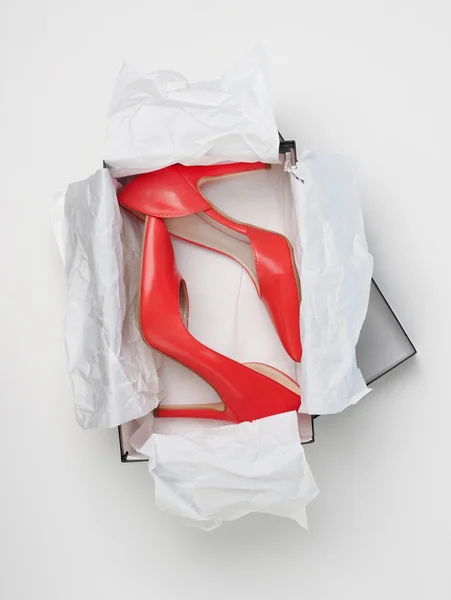 Red high heels in box — Stock Photo, Image