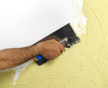 Construction worker plastering a wall clipart