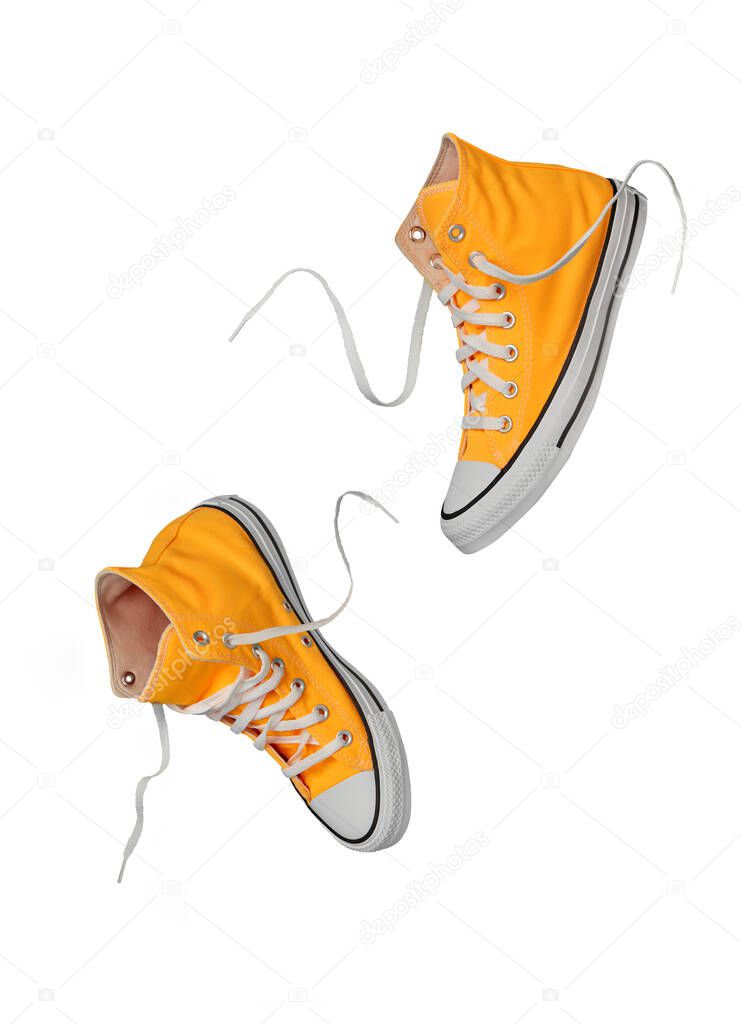 Yellow canvas shoes on white