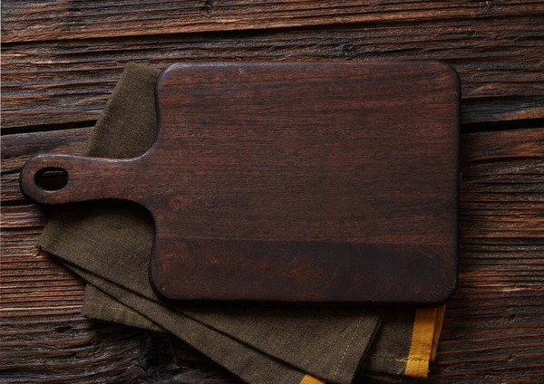 Wooden cutting board on wooden table