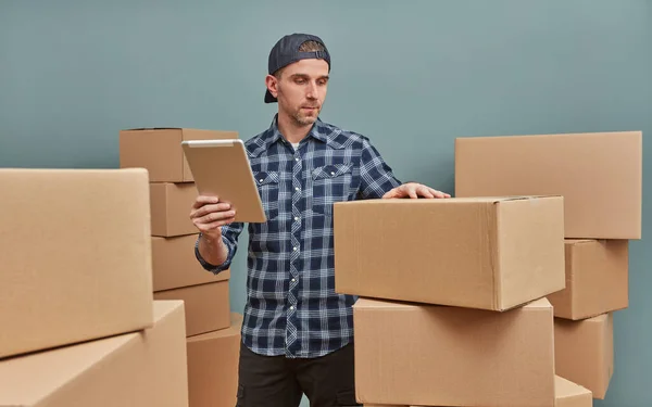 Man organizing cardboard boxes