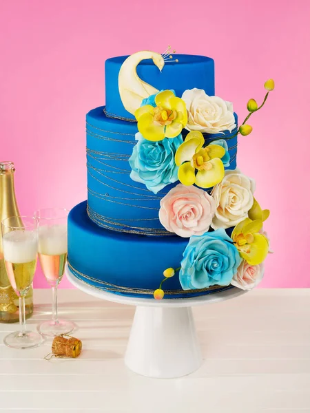 Beautiful flowers cake on blue