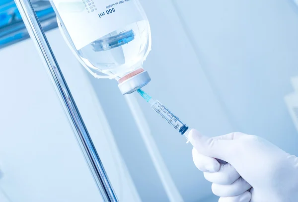 Syringe and infusion — Stock Photo, Image