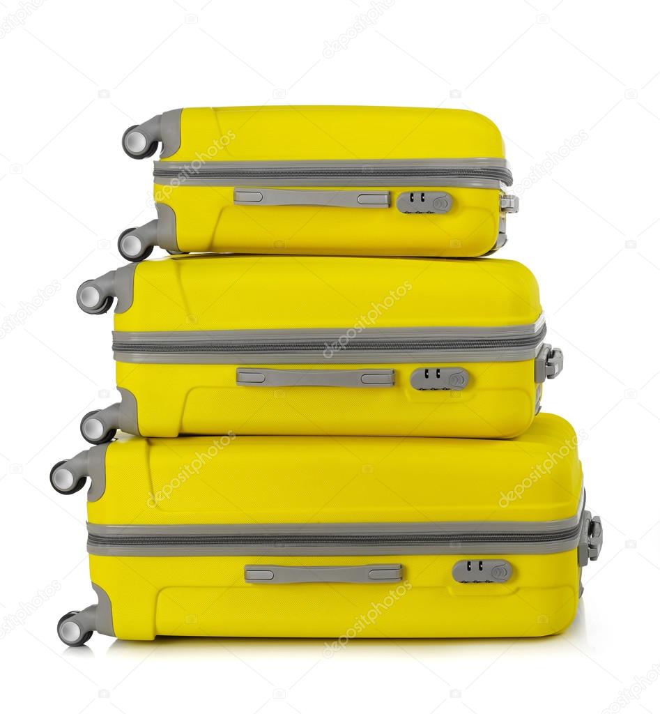 Yellow suitcases on white