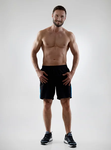 Cheerful shirtless sportsman — Stock Photo, Image