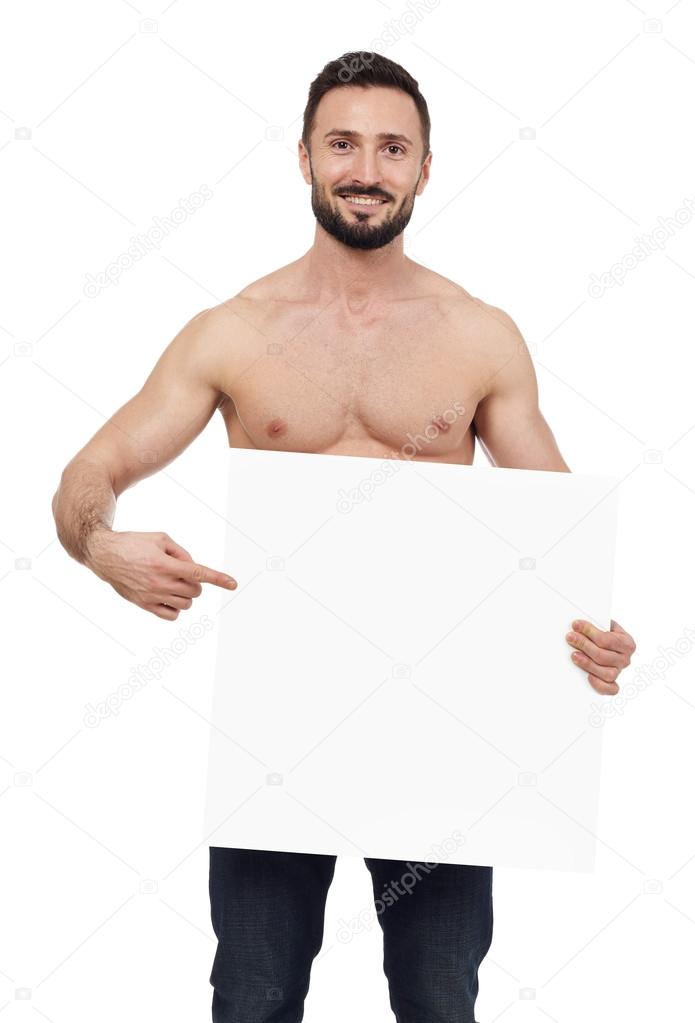 Shirtless man pointing to a blank sign