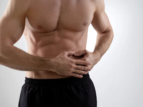 Dolor abdominal, fondo gris — Foto de Stock