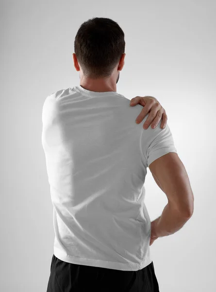 Shoulder pain, gray background — Stock Photo, Image