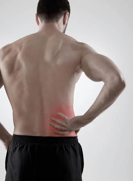 Rückenschmerzen, grauer Hintergrund — Stockfoto