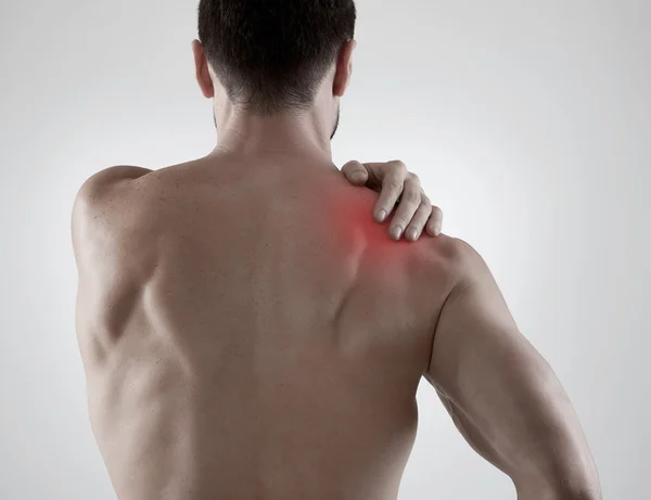 Shoulder pain, gray background — Stock Photo, Image
