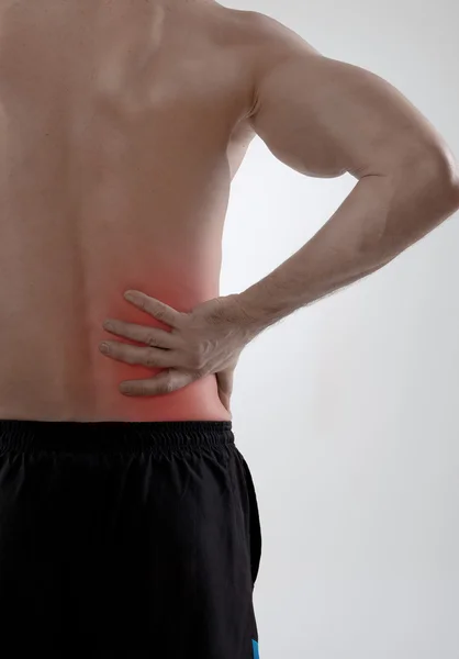 Dolor de espalda, fondo gris — Foto de Stock
