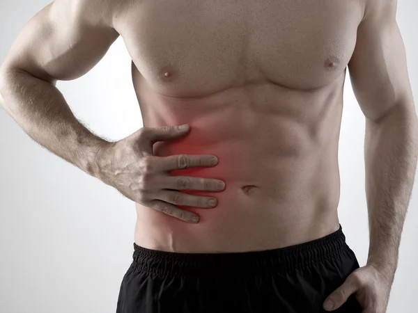 Dolor abdominal, fondo gris — Foto de Stock