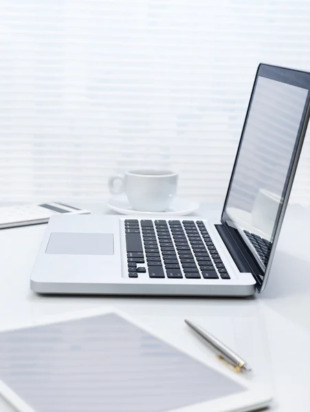 Office desk with laptop and tablet — Stock Photo, Image