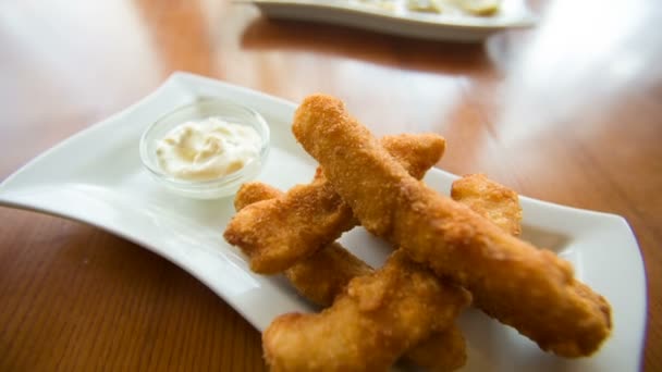 Chicken strips on a plate — Stock Video