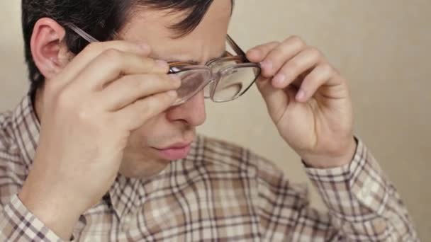 Nerd wearing two pair of glasses — Stock videók