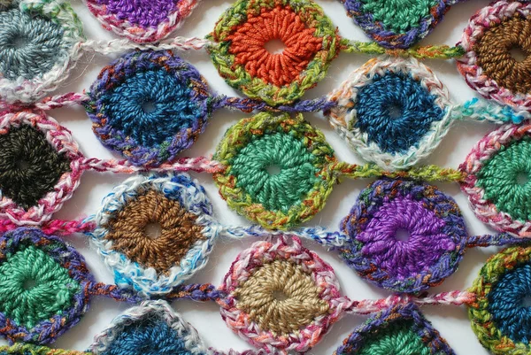 Crocheted snowflakes on canvas in black and white — Stock Photo, Image