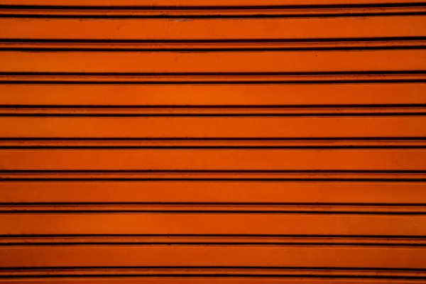 オレンジ鋼ローラ シャッター ドア背景 (h とガレージのドア — ストック写真