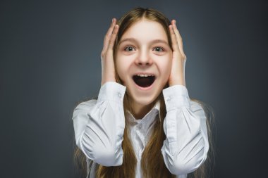 Closeup Portrait of happy girl going surprise isolated on gray background clipart
