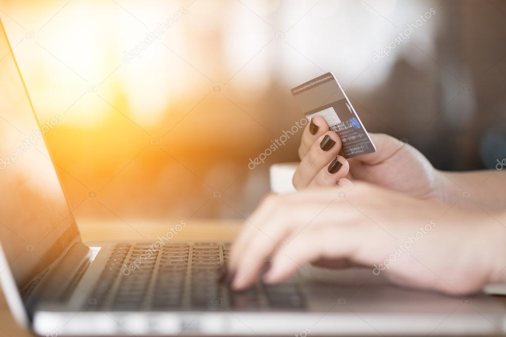 Online payment,Woman's hands holding a credit card 