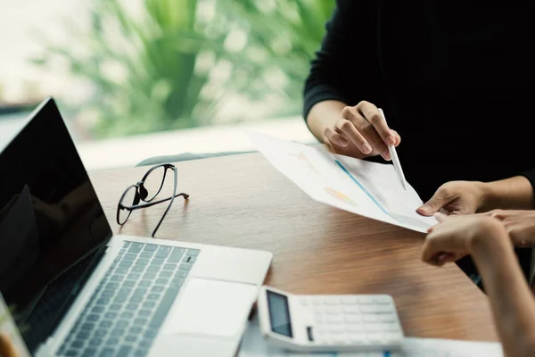 Close up business adviser meeting to analyze and discuss the situation on the financial report in the meeting room.Investment Consultant,Financial Consultant,Financial advisor and accounting concept.