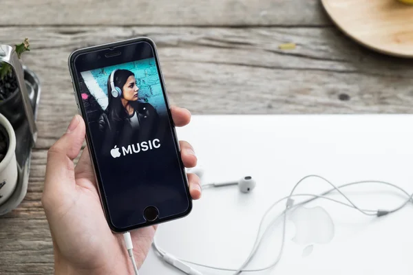 CHIANG MAI,THAILAND - DEC 4, 2015: A man hand holding screen shot of Apple music app showing on iPhone 6