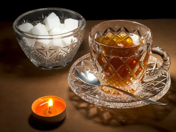 Kopp te med socker och ljus — Stockfoto