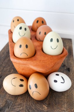 Happy and Sad Eggs Concept. Fresh vs. Not Fresh Eggs