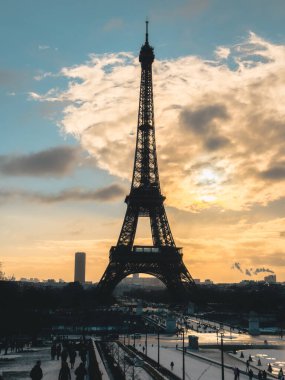 Winter view of the Eiffel Tower in Paris, France, captured during the colder season with a soft, atmospheric light.