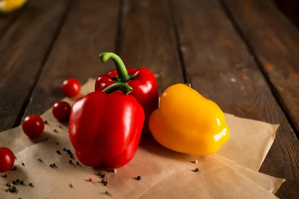 Fresh vegetables, bulgarian pepper, cherry tomatoes and spices on wooden background — Stock Photo, Image