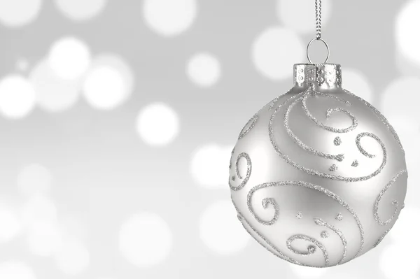 Glitter arka plan üzerinde beyaz Noel topu