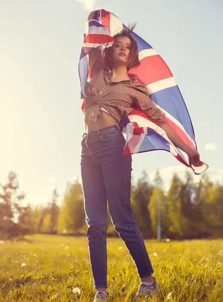 Stylish girl with the flag outdoor Stock Image