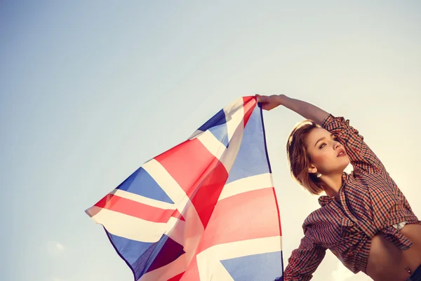 Stylish girl with the flag outdoor Royalty Free Stock Photos