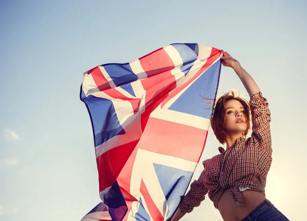 Stylish girl with the flag outdoor Royalty Free Stock Photos