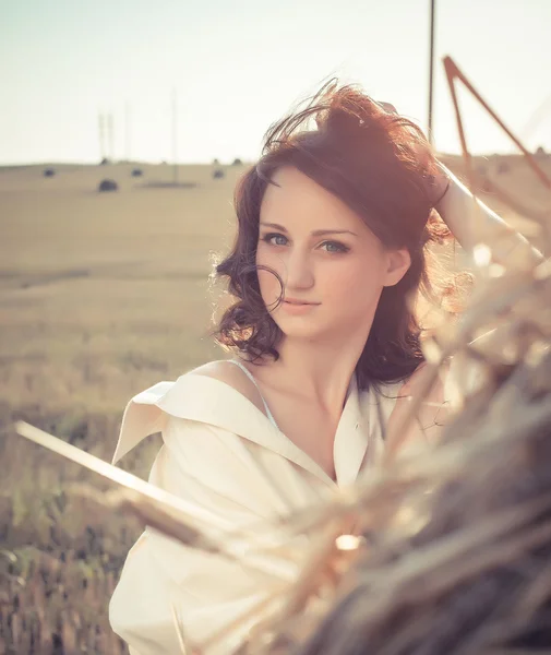 Sensual girl near a stack of a hay portrait — Stock Photo, Image