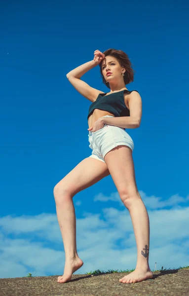 Beautiful sensual girl near water on the background of the blue sky — Stock Photo, Image