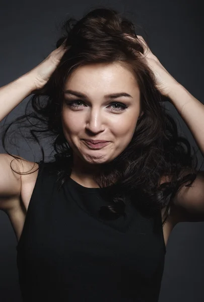 High fashion sensual girl in the black dress in the studio