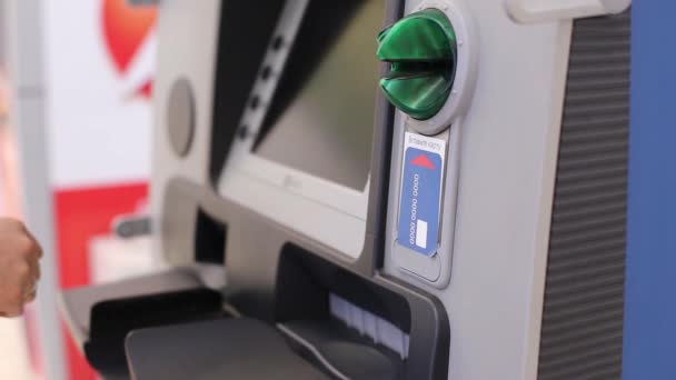 Girl Inserts The Card Into The ATM And Gaining PIN — Stock Video