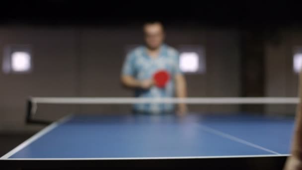 Young adult man playing a game of table tennis — Stock Video