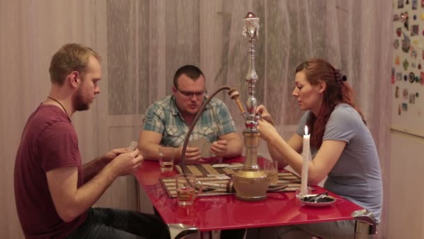 Among friends smokes hookah and talking — Stock Video