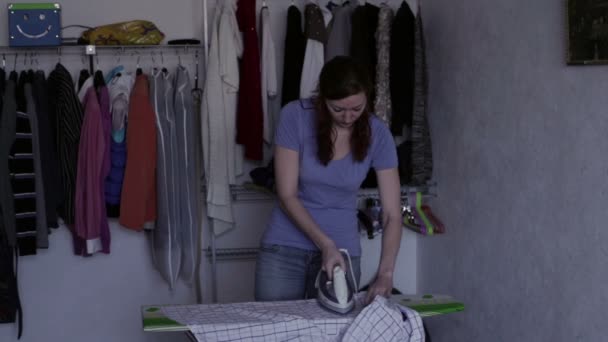 Housewife ironing a shirt — Stock Video