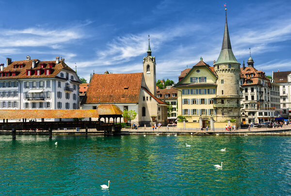 Lucerne, Switzerland, view over Reuss river to the old town, the Chapel and wooden Chapel bridge