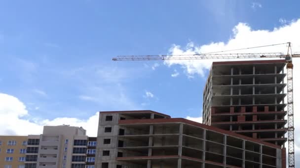 Building under construction and Tower crane — Stock Video