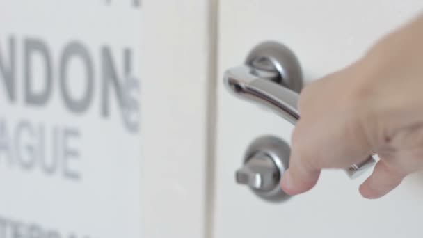 Hand opens a white Door with the door Handle — Stock Video