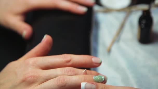 Beautiful womens manicure with a pattern on the nails — Stock Video